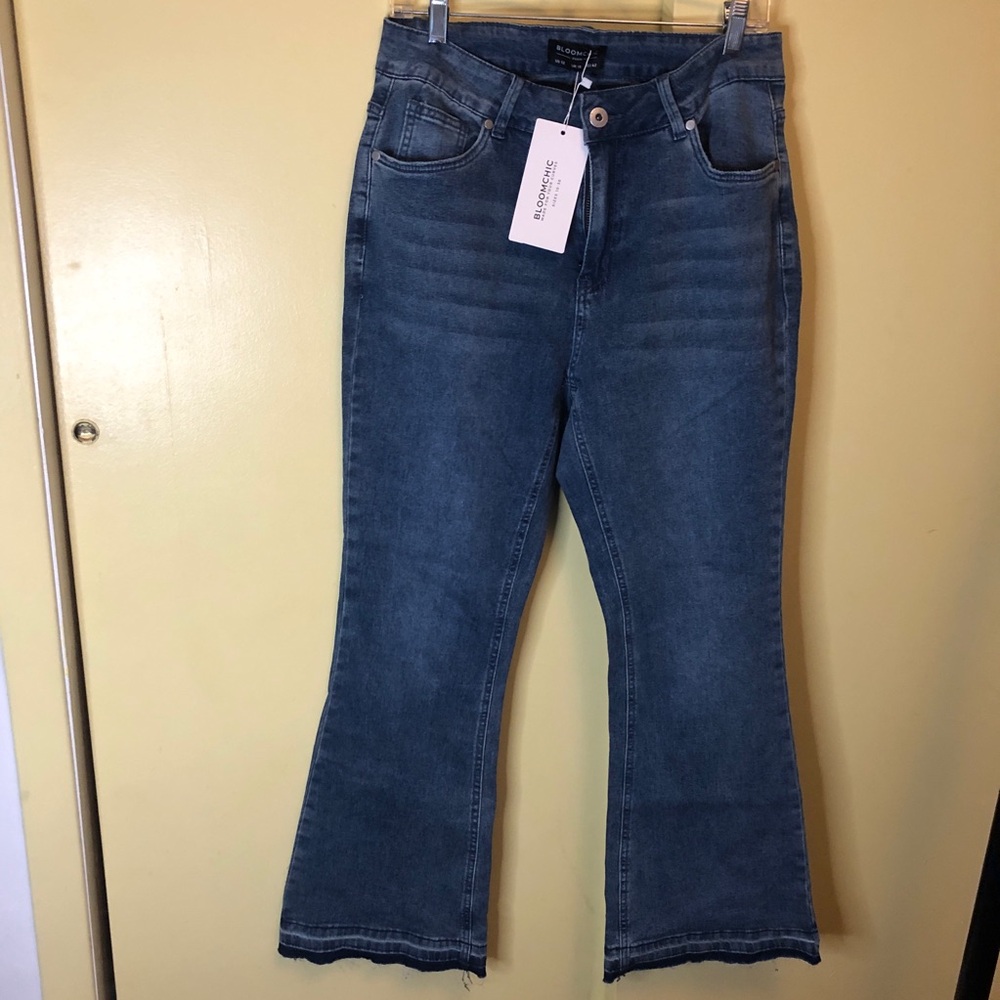 BloomChic light wash, boot cut, raw hem. Size 12 with tag